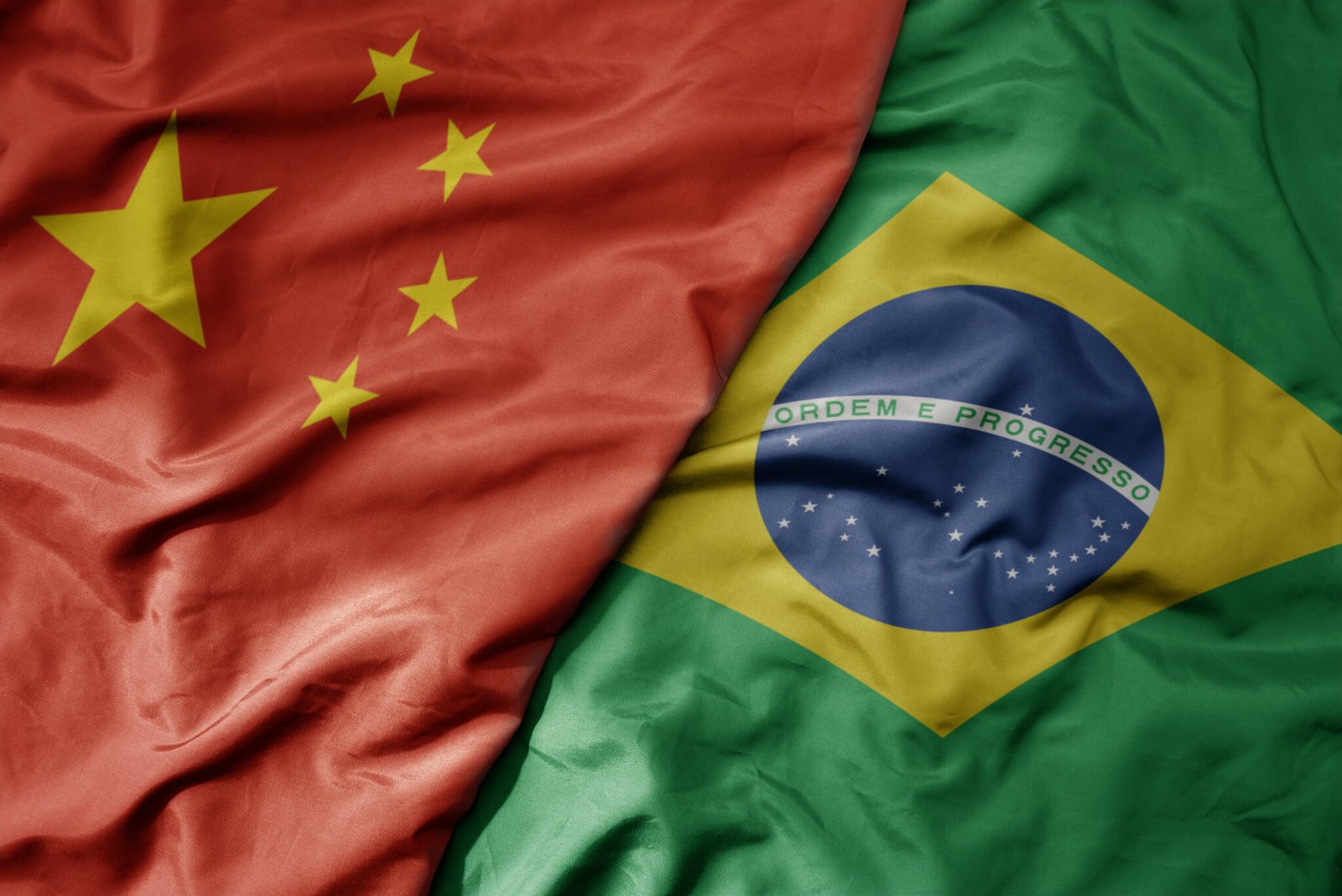 big waving national colorful flag of china and national flag of brazil .